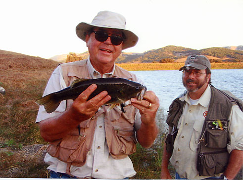 David S. shows off his bass while Carlo B looks on